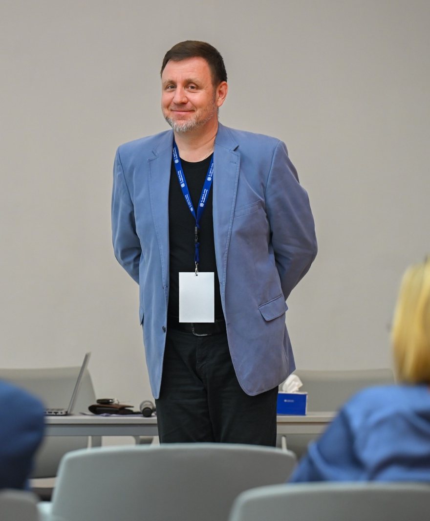 Dr. Sergey Melnikov presenting at a conference